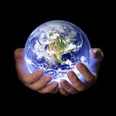 pic of earth  - man holding a glowing earth globe in his hands - JPG 