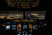 stock photo of final  - Night view from the cockpit of an Airbus A330 on final approach before landing at Toronto Pearson international airport - JPG 