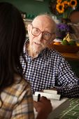 picture of home  - Elderly man in home with care provider or survey taker in kitchen - JPG 
