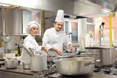 picture of restaurant  - Cooks preparing food in restaurant kitchen - JPG 