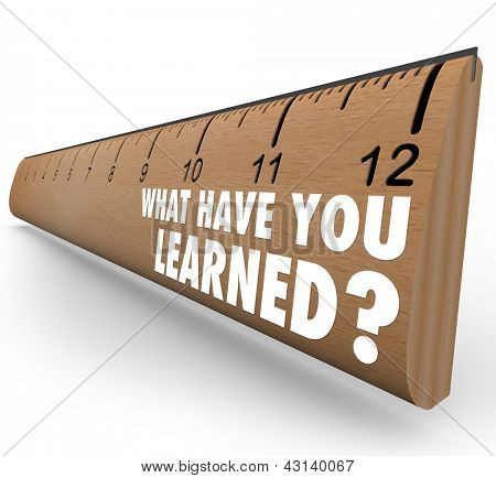 Picture or Photo of The question What Have You Learned? on a wooden ruler asking you to assess what knowledge you have attained through education, training or other life experience