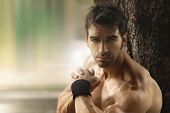 pic of outdoor  - Outdoor portrait of a muscular shirtless hot guy with copy space - JPG 
