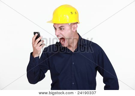 Picture or Photo of An architect yelling at his phone.