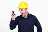 stock photo of construction worker  - An architect yelling at his phone - JPG 