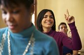 stock photo of people  - People at school student raising hand and asking question to professor during class in college Law School University of Havana Cuba - JPG 