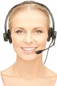 stock photo of helpline  - close up of friendly female helpline operator with headphones - JPG 