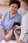 foto of pressure  - Patient is being observed by doctor - measuring blood pressure
** Note: Shallow depth of field - JPG 