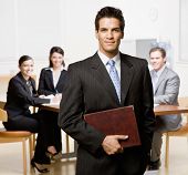 picture of meeting  - Confident businessman with notebook and co - JPG 