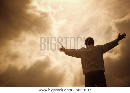 Picture or Photo of Man and drammatic clouds religion concept selective focus