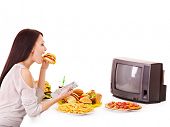 picture of food  - Woman eating fast food and watching TV - JPG 