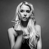 stock photo of art  - Fine art portrait of a beautiful lady with cigarette - JPG 