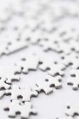 stock photo of puzzle  - white jigsaw puzzle - JPG 