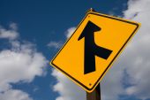 stock photo of merge  - A yellow US road sign offering direction - JPG 