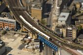stock photo of tilting  - Aerial view of a train on a bridge in London - JPG 