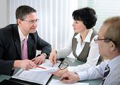 stock photo of meeting  - Senior couple meeting with agent in a office - JPG 