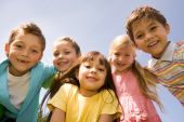image of preschool  - Portrait of smart preschoolers embracing each other on background blue sky - JPG 