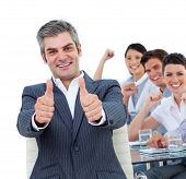 stock photo of business people  - Happy business people celebrating a succes in an office - JPG 
