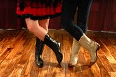 foto of on-line  - Female Legs in Cowboy Boots in a Line Dance Step on hardwood floor - JPG 