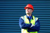 stock photo of construction worker  - construction worker with folded arms - JPG 