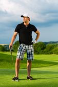 pic of golf  - Young sportive man playing golf on a course - JPG 
