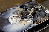 stock photo of disk  - detail shot of a massive destroyed hard disk drive - JPG 