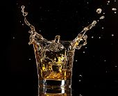 picture of black  - Glass of whiskey with splash - JPG 