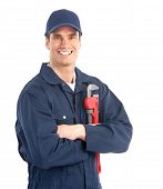 foto of construction worker  - Young handsome plumber worker with adjustable wrench - JPG 