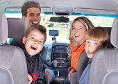 stock photo of family  - Smiling happy family and a family car - JPG 