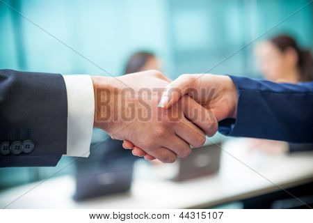 Picture or Photo of Business handshake at the office
