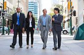 image of group  - Group of happy business people walking together on street - JPG 