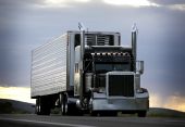 picture of truck  - big truck driving on a highway with cloudy sky in background - JPG 
