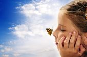 picture of future  - butterfly resting on the nose of al girl - JPG 