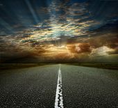 picture of transportation  - Asphalted road on the background of storm clouds - JPG 