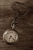 image of watch  - Pocket watch on wood macro detail in duotone - JPG 