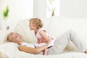 stock photo of home  - Happy mother with a daughter at home - JPG 