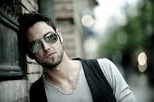 stock photo of man  - Young attractive man in urban background - JPG 