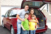 stock photo of family  - Smiling happy family and a family car - JPG 