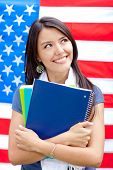 foto of english  - English female student with the American flag at the background - JPG 
