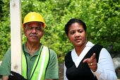 picture of construction worker  - Construction worker on the job with his boss - JPG 