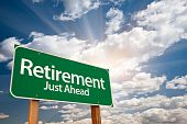 stock photo of retirement  - Retirement Green Road Sign with Dramatic Clouds Sun Rays and Sky - JPG 