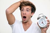 picture of tick tock  - Man in a panic after sleeping in - JPG 