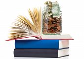 pic of future  - Books with penny jar filled with coins and banknotes  - JPG 