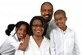 foto of family  - Family of four dressed in white over a white background - JPG 