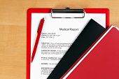 pic of medical  - Medical report on a red holder - JPG 