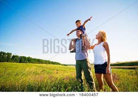 Picture or Photo of Happy family having fun outdoors