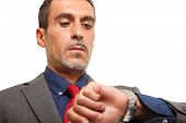 pic of watch  - Portrait of a businessman looking at his watch - JPG 
