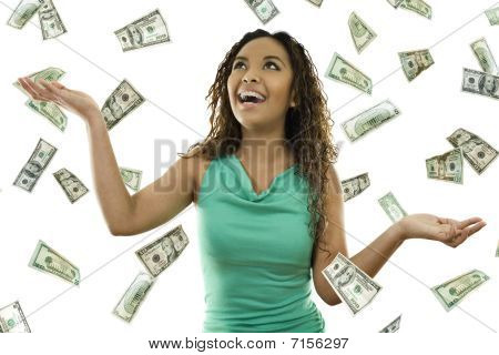 Picture or Photo of Stock image of woman standing with open arms amidst falling money