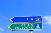 stock photo of road sign  - A French road sign pointing the way to Calais and Boulogne two famous channel ports for ferry travel to the UK - JPG 