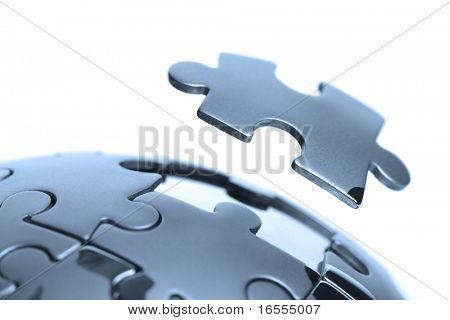 Picture or Photo of Last piece of a global puzzle concept for business solutions and strategy
