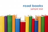 picture of rows  - Many colorful books in a row creating a border frame - JPG 